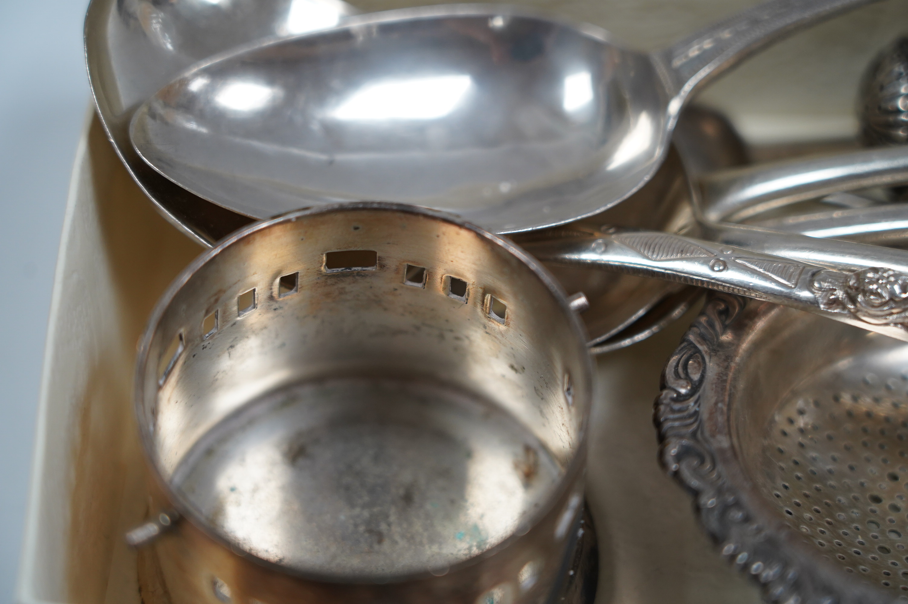 A small group of assorted mainly Georgian silver flatware and three other items, including a silver pepper. Condition - poor to fair